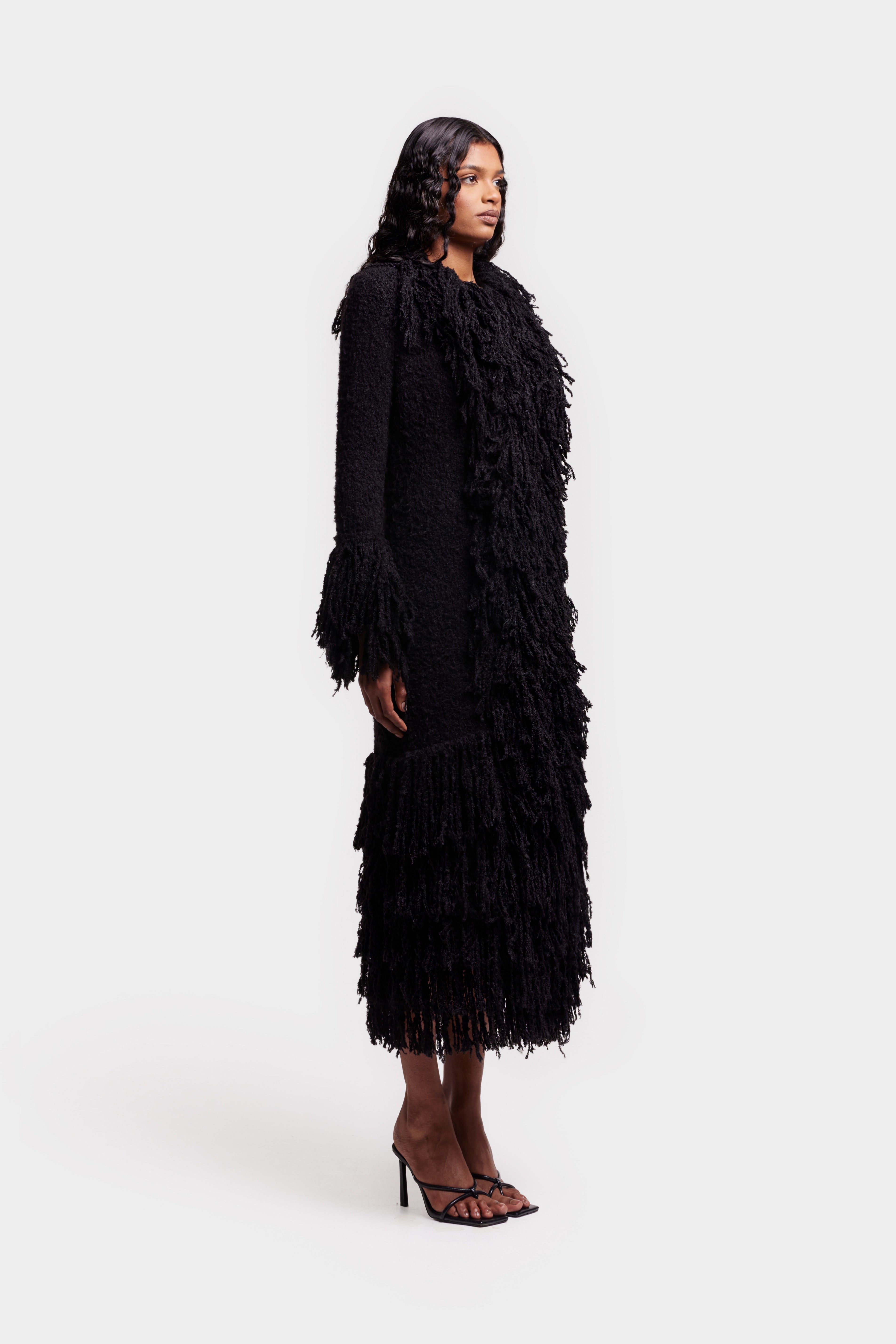 black dress with fur coat Taylor Swift Wore Glam Black Dress to Support Emma Stone at Premiere
